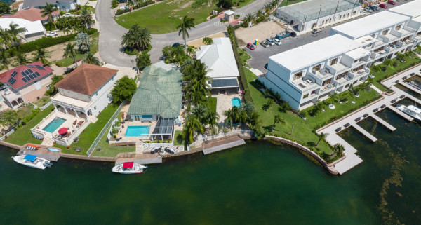 Gated Bimini Drive, Grand Harbour, Single Level 4 Bed Canal Front Home REDUCED And OWNER FINANCING!